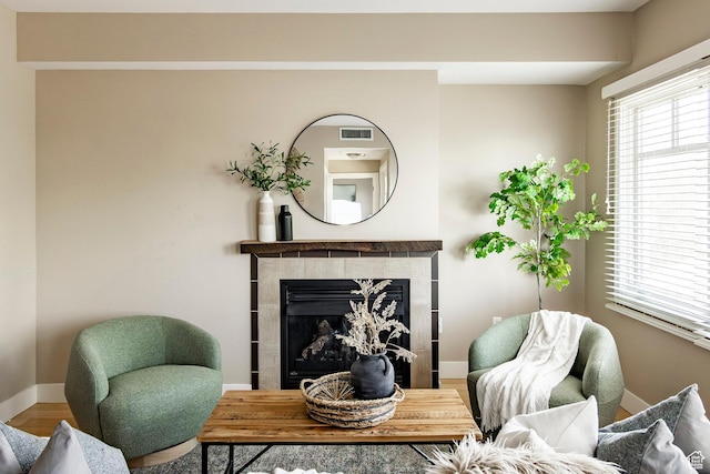 1988 S 1100 E Unit 308, Salt Lake City, UT 84105 - sitting room with plenty of natural light, wood finished floors, and a fireplace