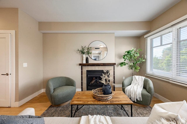 1988 S 1100 E Unit 308, Salt Lake City, UT 84105 - living room with wood finished floors and a tiled fireplace