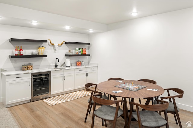 1282 N 1525 E Unit 68, Payson, UT 84651 - dining room with wine cooler, bar with sink, and light wood finished floors