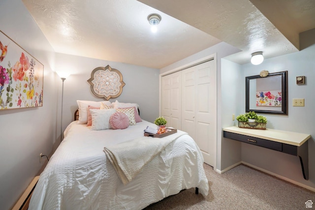 117 E 300 S, Gunnison, UT 84634 - bedroom with baseboard heating, light colored carpet, and a closet