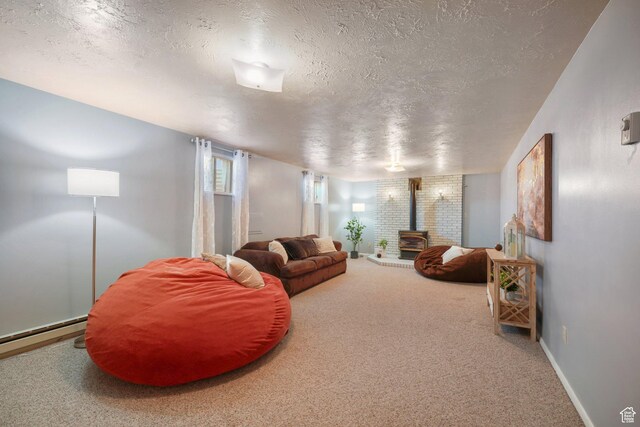 117 E 300 S, Gunnison, UT 84634 - living room with a wood stove, a textured ceiling, carpet, and a baseboard radiator