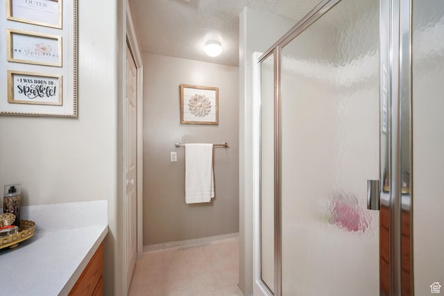 117 E 300 S, Gunnison, UT 84634 - bathroom featuring a shower stall, vanity, and a textured ceiling
