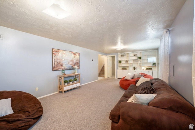 117 E 300 S, Gunnison, UT 84634 - living area featuring carpet floors, stairway, and a textured ceiling