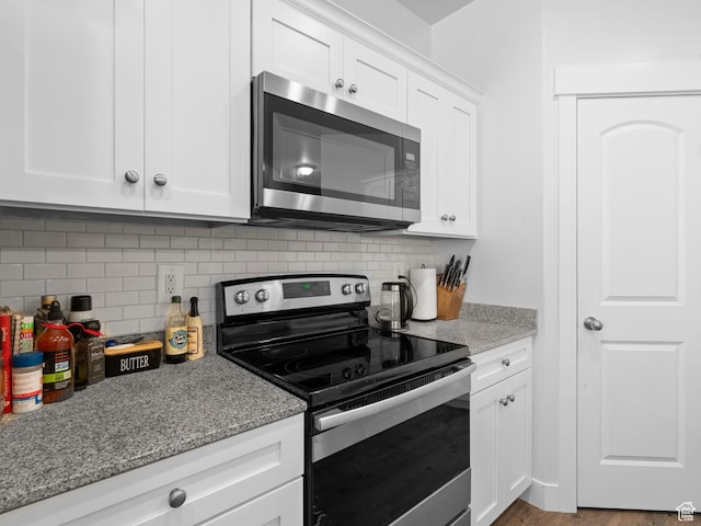 4070 W 1630 N, Lehi, UT 84043 - kitchen with stainless steel appliances, decorative backsplash, light stone counters, and white cabinetry