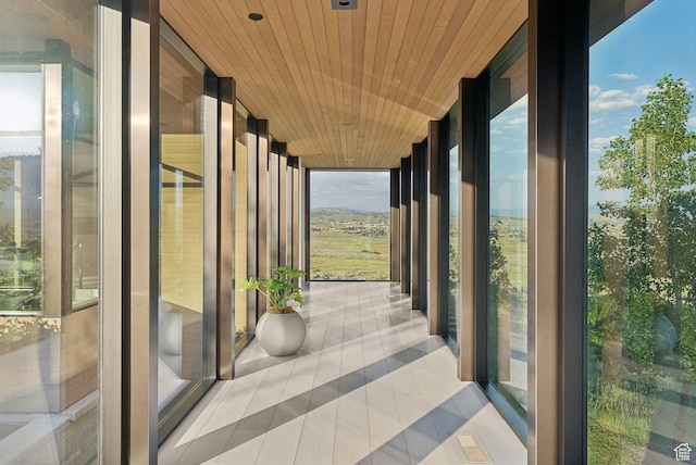 8078 N Red Fox Ct, Park City, UT 84098 - unfurnished sunroom featuring expansive windows, tile patterned floors, and wood ceiling