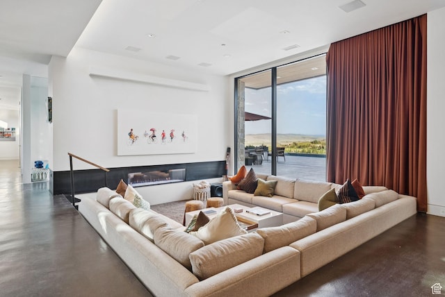 8078 N Red Fox Ct, Park City, UT 84098 - living area with a wall of windows and finished concrete floors