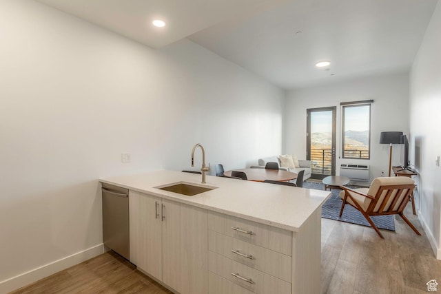 2303 Deer Hollow Rd Unit 2114, Park City, UT 84060 - kitchen featuring a peninsula, stainless steel dishwasher, light wood-style floors, an AC wall unit, and recessed lighting
