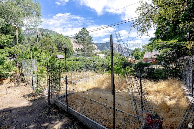 1639 20th S, Ogden, UT 84401 - gate featuring a garden and a mountain view