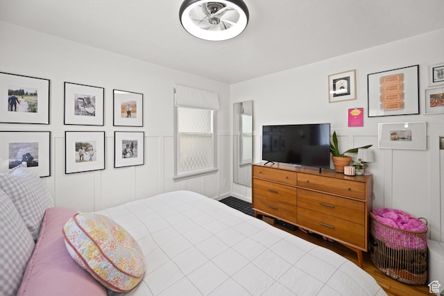 1639 20th S, Ogden, UT 84401 - bedroom featuring a decorative wall, wood finished floors, and a wainscoted wall