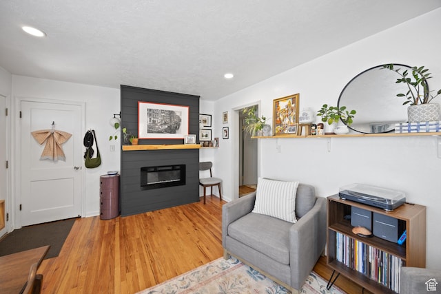 1639 20th S, Ogden, UT 84401 - living area with a fireplace, recessed lighting, and wood finished floors