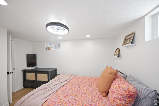 1639 20th S, Ogden, UT 84401 - bedroom with wood finished floors, recessed lighting, and a textured ceiling