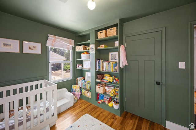 1639 20th S, Ogden, UT 84401 - bedroom with wood finished floors and a crib
