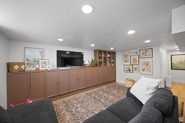 1639 20th S, Ogden, UT 84401 - living area with a textured ceiling, wood finished floors, and recessed lighting