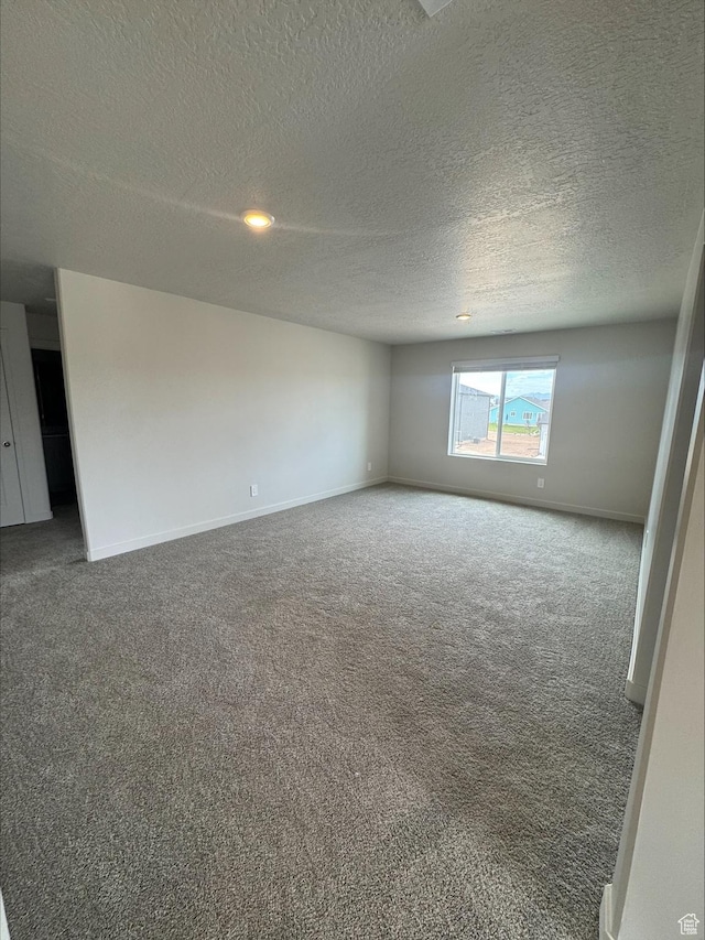 3533 N Browning Unit 1234, Eagle Mountain, UT 84005 - carpeted spare room featuring a textured ceiling