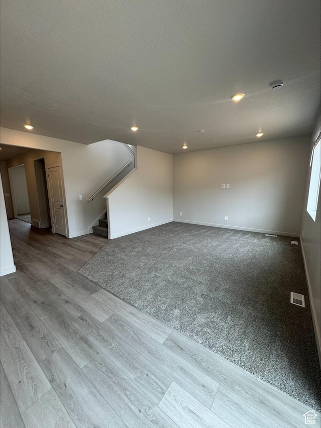 3533 N Browning Unit 1234, Eagle Mountain, UT 84005 - spare room with stairs, recessed lighting, a smoke detector, and wood finished floors