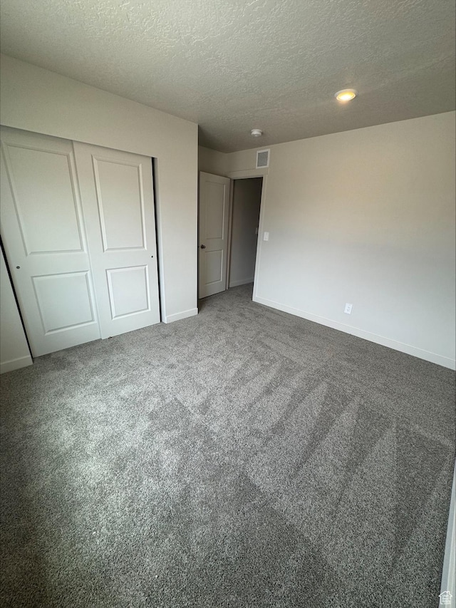 3533 N Browning Unit 1234, Eagle Mountain, UT 84005 - unfurnished bedroom with a textured ceiling, a closet, carpet, and recessed lighting