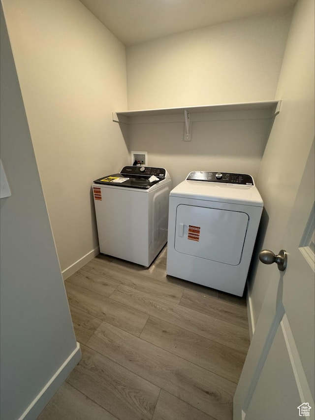 3533 N Browning Unit 1234, Eagle Mountain, UT 84005 - washroom with washing machine and clothes dryer and light wood-type flooring