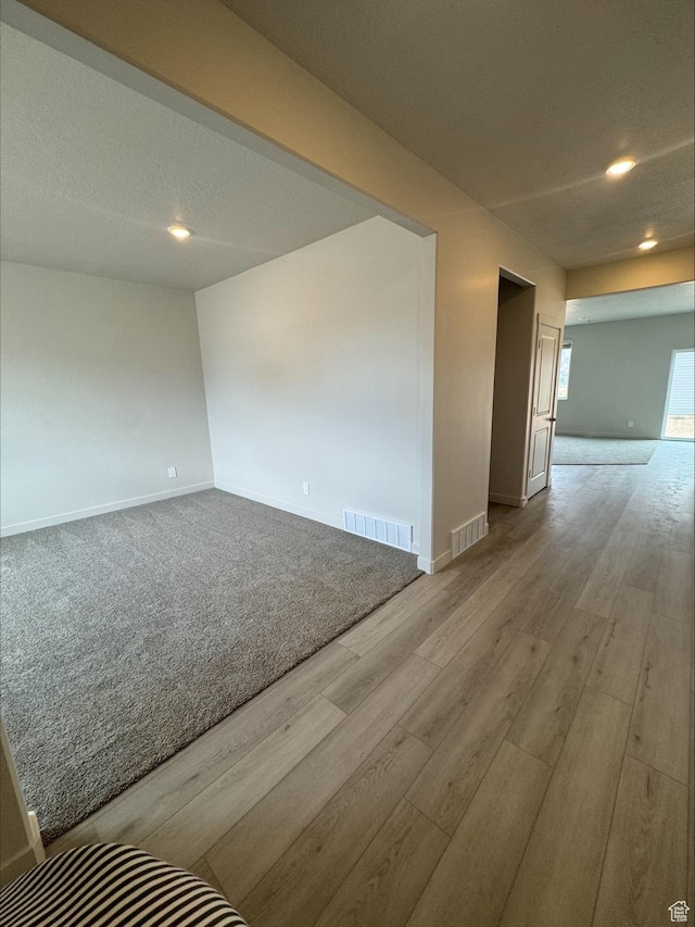 3533 N Browning Unit 1234, Eagle Mountain, UT 84005 - spare room with wood finished floors and recessed lighting
