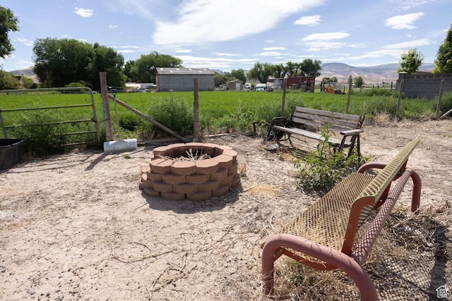 205 W 575 S, Venice, UT 84701 - view of patio / terrace featuring a fire pit, a mountain view, and a view of countryside
