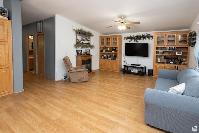 205 W 575 S, Venice, UT 84701 - living area with a glass covered fireplace, ceiling fan, and light wood-type flooring
