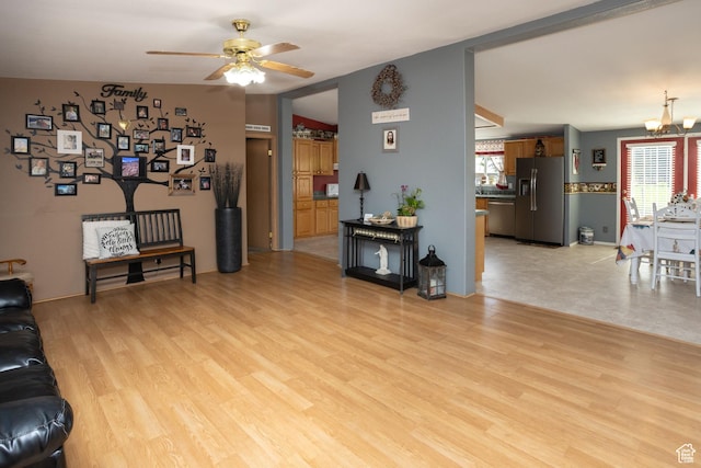 205 W 575 S, Venice, UT 84701 - living room featuring healthy amount of natural light, a ceiling fan, a chandelier, and light wood-style flooring
