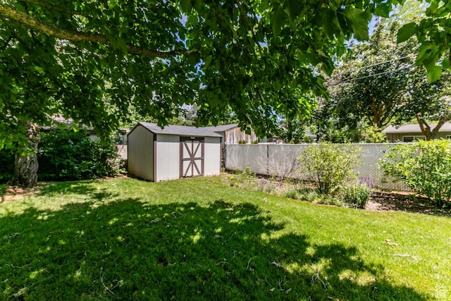 5681 S Calann Dr E, Holladay, UT 84121 - fenced backyard featuring a storage shed