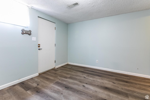 5681 S Calann Dr E, Holladay, UT 84121 - empty room featuring dark wood finished floors and a textured ceiling
