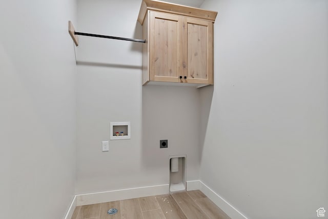 1856 S 2575 W, West Haven, UT 84401 - laundry room featuring cabinet space, electric dryer hookup, washer hookup, and light wood-style flooring