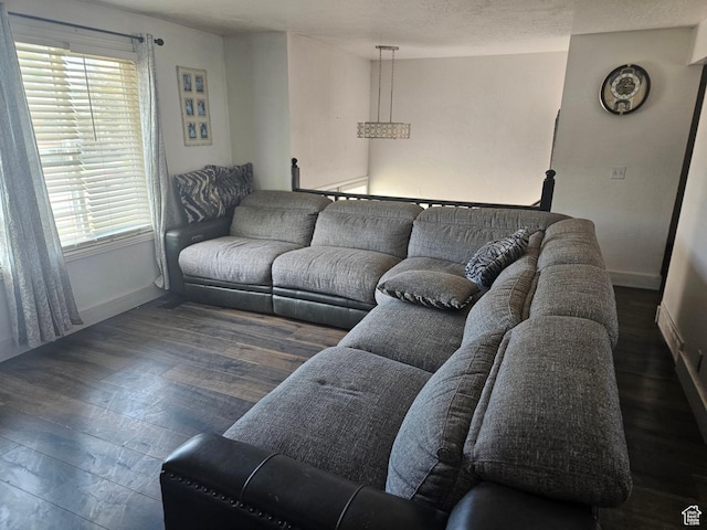 3243 S Fairlane St, Magna, UT 84044 - living room featuring baseboards and wood finished floors