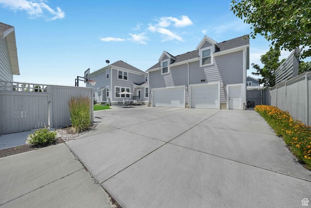 4966 W Kitsap Way Unit 10-532, South Jordan, UT 84009 - view of front of home featuring a garage, driveway, and a residential view