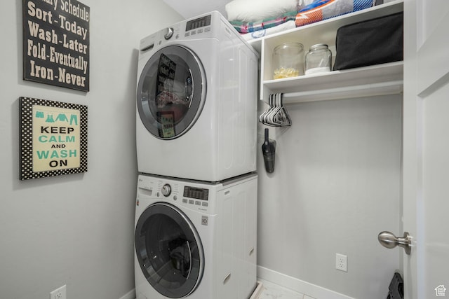 4966 W Kitsap Way Unit 10-532, South Jordan, UT 84009 - laundry room featuring stacked washer / drying machine and marble finish floors