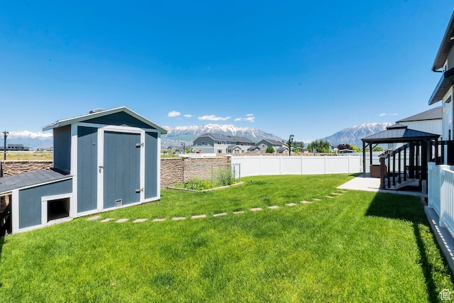 142 W Hackberry Rd, Vineyard, UT 84059 - fenced backyard featuring a shed, a gazebo, and a mountain view