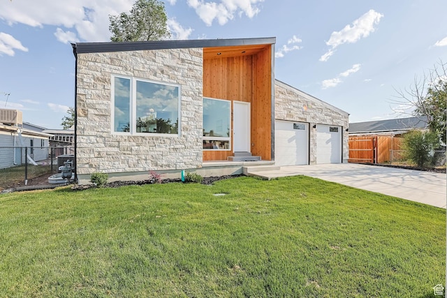 3839 W Saddler Dr, West Jordan, UT 84088 - view of front of house with stone siding, a garage, and driveway