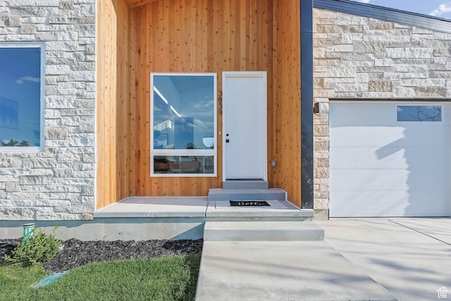 3839 W Saddler Dr, West Jordan, UT 84088 - view of exterior entry with stone siding and a garage