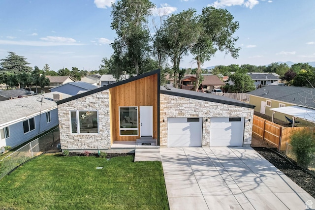 3839 W Saddler Dr, West Jordan, UT 84088 - view of front of home featuring stone siding, concrete driveway, an attached garage, and a residential view