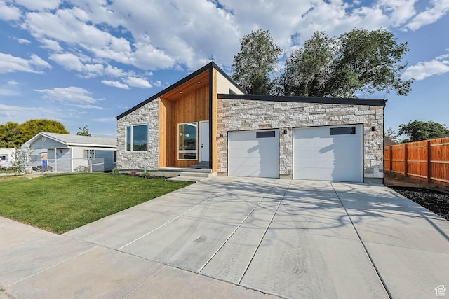 3839 W Saddler Dr, West Jordan, UT 84088 - contemporary house featuring stone siding, driveway, and a garage