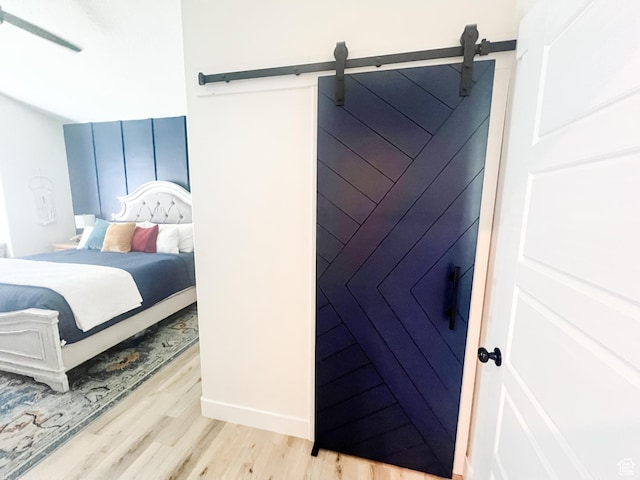 291 W 950 S, Vernal, UT 84078 - bedroom with wood finished floors and a barn door