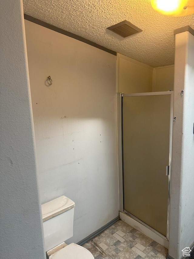 419 E 700 N, Vernal, UT 84078 - full bath with a shower stall, a textured ceiling, and tile patterned floors