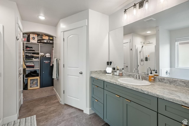 12333 S Pesky Ln, Herriman, UT 84096 - full bath with a shower stall, vanity, and a walk in closet