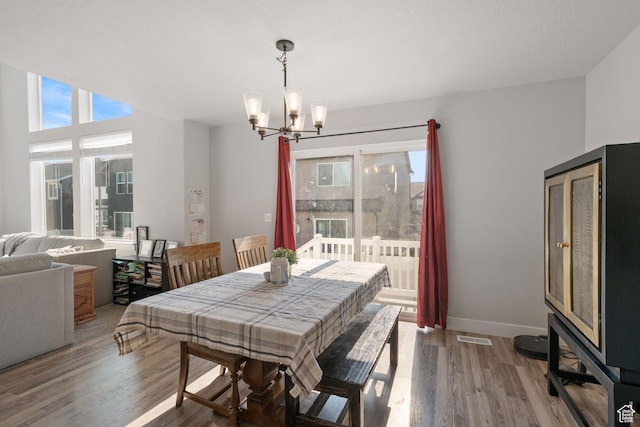 12333 S Pesky Ln, Herriman, UT 84096 - dining area featuring a chandelier and wood finished floors