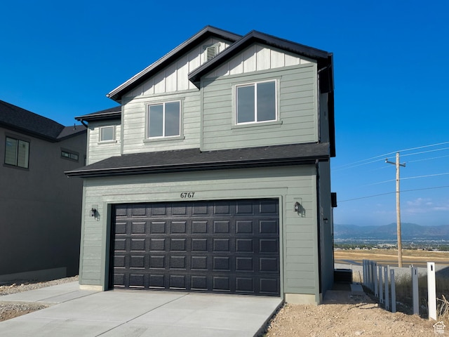 6767 S Glade Creek Dr Unit 230, West Jordan, UT 84081 - garage with concrete driveway and a mountain view
