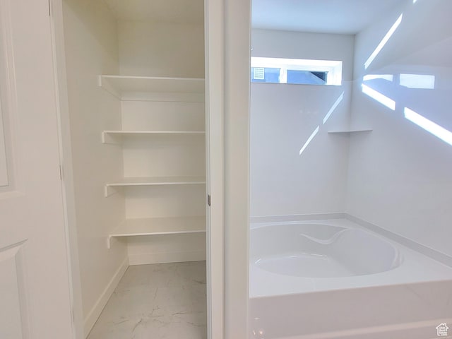 6767 S Glade Creek Dr Unit 230, West Jordan, UT 84081 - full bathroom with marble look tile flooring and a bath