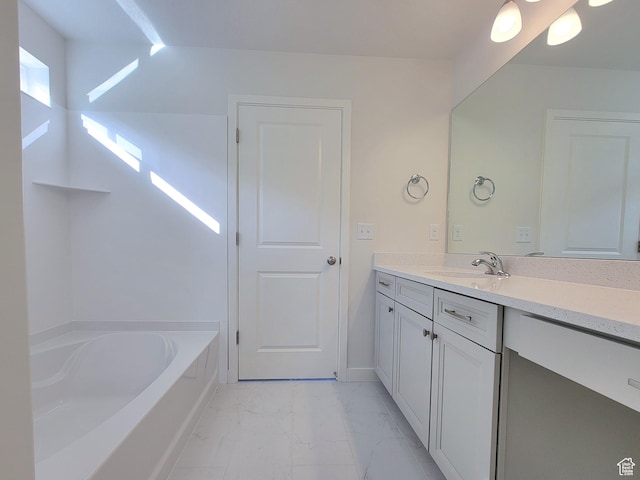 6767 S Glade Creek Dr Unit 230, West Jordan, UT 84081 - bathroom with marble look tiles, vanity, and a garden tub