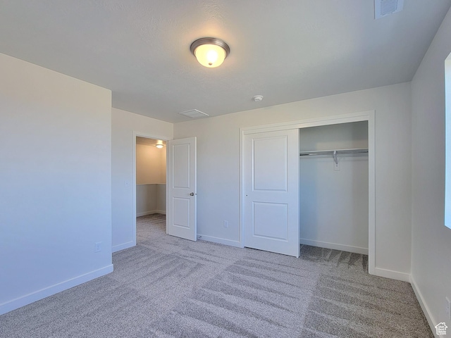 6767 S Glade Creek Dr Unit 230, West Jordan, UT 84081 - unfurnished bedroom featuring carpet and a closet