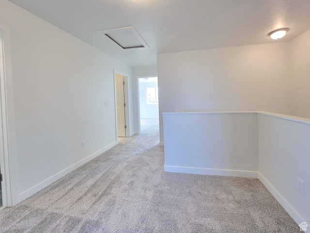 6767 S Glade Creek Dr Unit 230, West Jordan, UT 84081 - carpeted spare room featuring baseboards and attic access