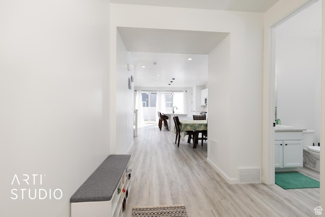 6392 N Wild Mare Way, Stansbury Park, UT 84074 - corridor featuring light wood-style flooring and recessed lighting