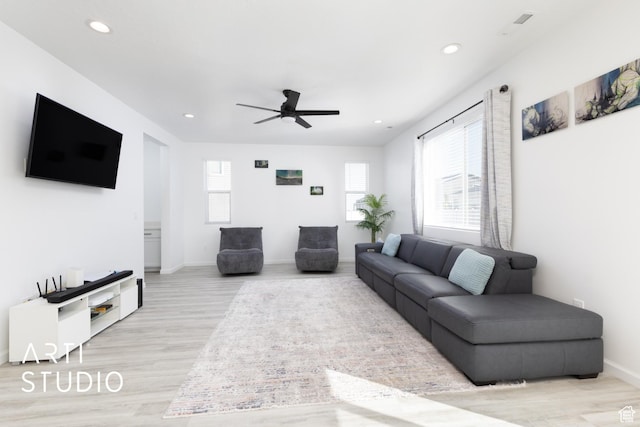 6392 N Wild Mare Way, Stansbury Park, UT 84074 - living area featuring plenty of natural light, light wood-style flooring, a ceiling fan, and recessed lighting