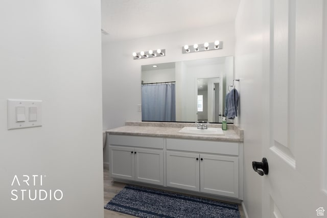 6392 N Wild Mare Way, Stansbury Park, UT 84074 - full bathroom with vanity and wood finished floors