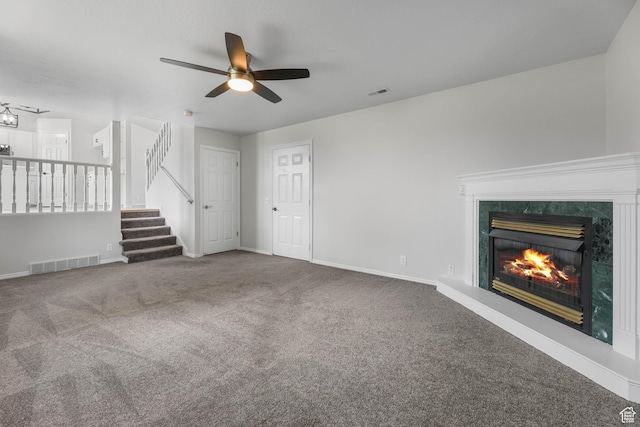 77 W 525 N, Layton, UT 84041 - unfurnished living room featuring carpet floors, ceiling fan, stairs, and a high end fireplace