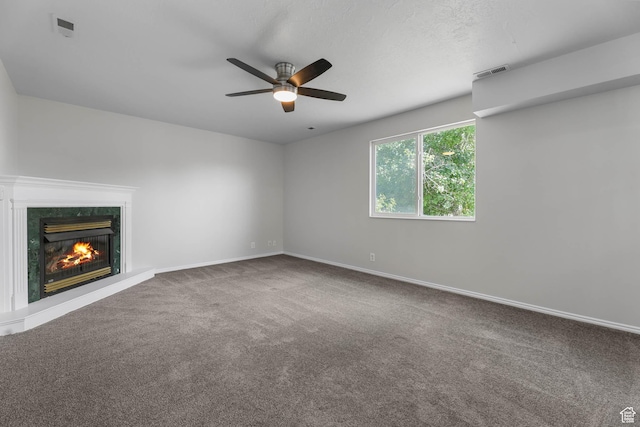 77 W 525 N, Layton, UT 84041 - unfurnished living room featuring a ceiling fan, carpet floors, and a premium fireplace